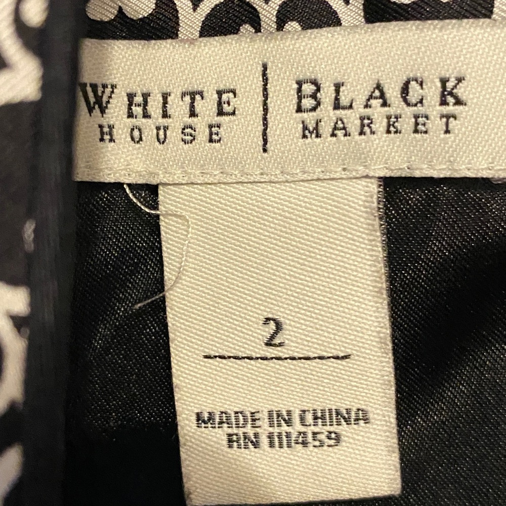 White House Black Market 100% silk black and white printed halter dress. - Picture 9 of 12